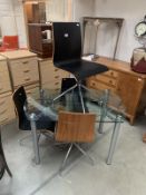 Extending glass top dining table with chairs