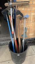 A selection of brushes & long armed cutting tool, weed extractor and other tools. (bin not included)