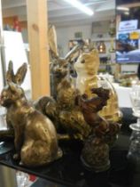 A mixed lot of rabbit and cat figures.