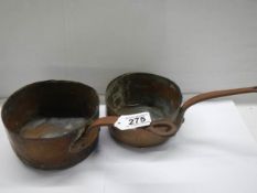Two old copper saucepans stamped Paris.