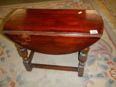 An oak swivel top occasional table, COLLECT ONLY.