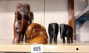 4 hand carved wooden elephants