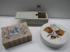 Two inlaid soapstone boxes and one other.