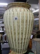 A tall ceramic vase.