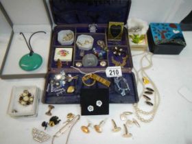 An unusual jewellery box with a mixed lot of costume jewellery.