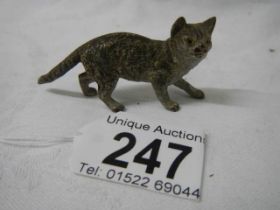 A small painted bronze cat.