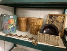 A collection of baskets, wooden bowl metal chime and rustic picture