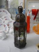 A metal Indian style candle lantern.