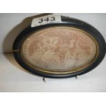 A framed oval engraving (crack to frame).