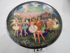 A Russian porcelain music box featuring a scene from Swan Lake.