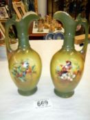 A pair of bird decorated ewers.