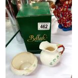 A boxed Belleek milk jug & An unboxed Belleek sugar bowl