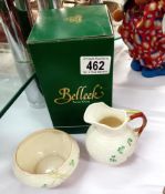 A boxed Belleek milk jug & An unboxed Belleek sugar bowl
