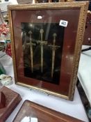 A gilt framed display of 3 ornamental daggers 35 x 55cm Frame
