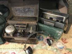 A pair of WW2 Morse code field radios with headphones