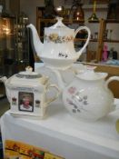 A Queen Elizabeth II Diamond Jubilee teapot and two others.