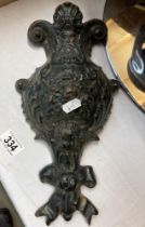 A cast metal wall hanging 31cm