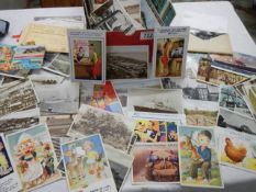 A good lot of assorted postcards including humorous.