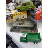 A quantity of boxed and loose die cast vehicles.