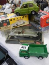 A quantity of boxed and loose die cast vehicles.