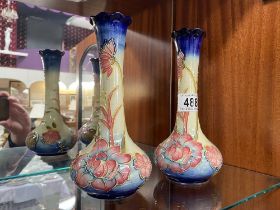 A pair of Tupton ware hand painted vases height 21cm