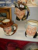 Three Royal Doulton character jugs.