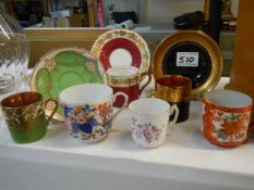 Three tea cups and saucers together with three tea cups.