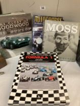 A collection of motor racing books featuring sterling moss & goodwood