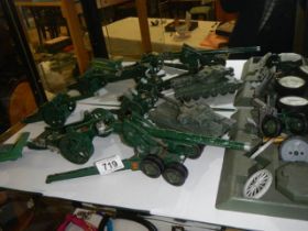 A quantity of military die cast including tanks, field guns etc.,