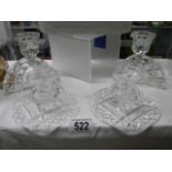 Two pairs of cut glass candlesticks.
