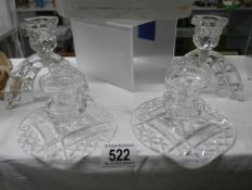 Two pairs of cut glass candlesticks.