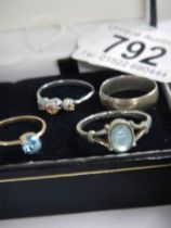 Four assorted dress ring in white metal.