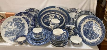 A good quantity of willow & other blue & white china & iron stone items