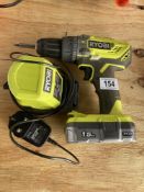 A Ryobi drill with charger