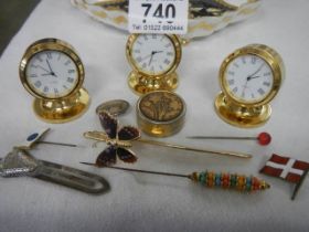 A mixed lot including clocks, hat pins etc.,