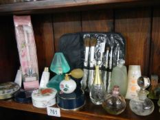 A mixed lot of perfume bottles and other vanity items etc.,