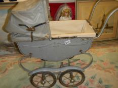 A circa 1950's dolls pram in need of restoration, COLLECT ONLY.