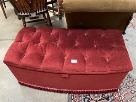 A red deep buttoned ottoman