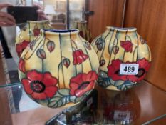 A pair of old Tupton ware poppy purse vases height 14cm