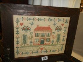 A framed and glazed sampler dated 1994.