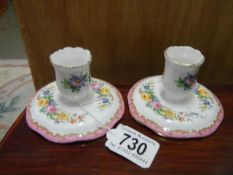 A pair of Staffordshire Crown porcelain candlesticks.