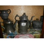 Two pewter teapots and other metal ware.