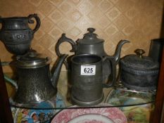 Two pewter teapots and other metal ware.