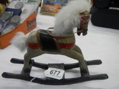 A miniature rocking horse.