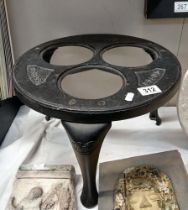 A cast iron warming tripod (Missing inserts)