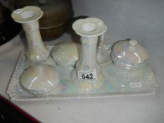 A ceramic dressing table set.