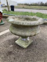 A Small concrete garden urn