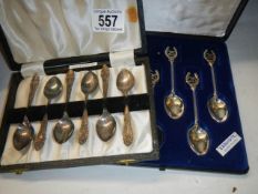 Two cased sets of six teaspoons.