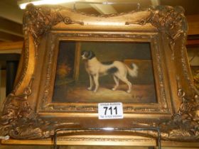 A gilt framed study of a dog signed G Roy.