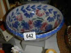 A hand painted pottery bowl.
